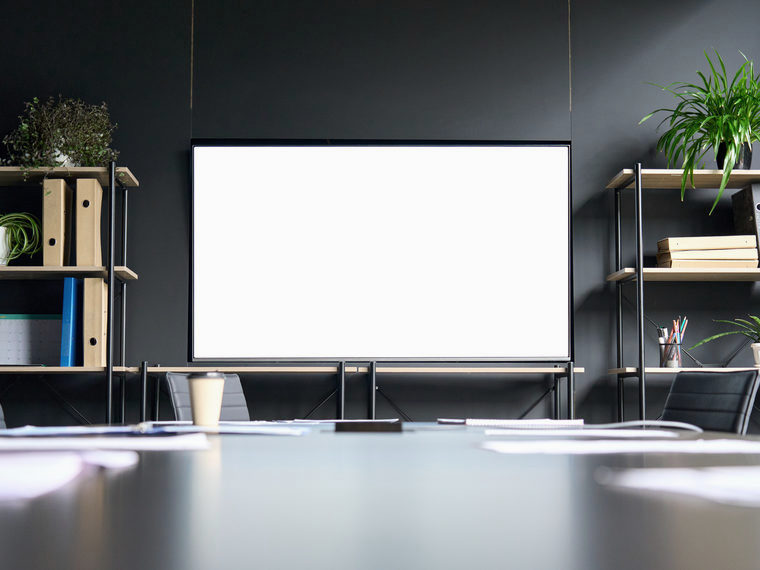An empty meeting room mid-morning, booked but unoccupied